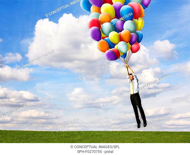 Man holding helium balloons