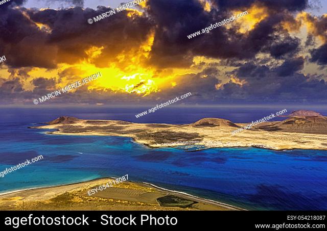 Sunrise over volcanic Island La Graciosa of the Atlantic Ocean - a view from Lanzarote, Canary Islands, Spain