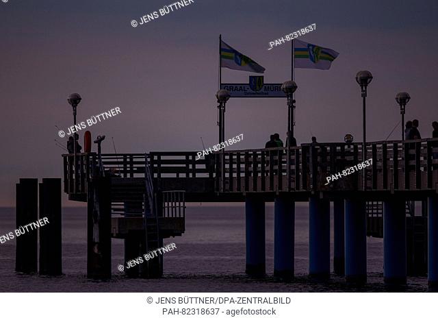 The pier after sunset on the Baltic coast near the Baltic Sea Spa Graal-Mueritz (Mecklenburg-Western Pomerania), Germany, 09 June 2016