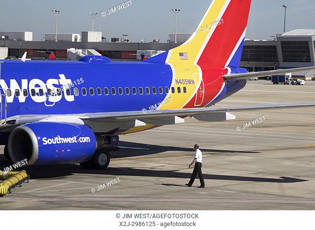 Atlanta, Georgia - A Southwest Airlines pilot does a visual inspection of his airplane before a flight from Hartsfield. “Jackson Atlanta International Airport