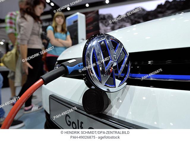 People look at Volkswagen Hybrid Golf GTE at the Auto Mobil International 2014 (AMI) in Leipzig,  Germany, 31 May 2014. The AMI car show runs from 31 May until...