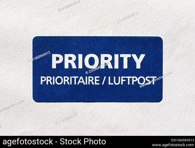 Priority (Prioritaire) mail label tag on a letter for airmail (Luftpost)