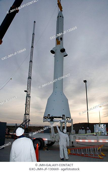 The launch abort system for the Pad Abort-1 (PA-1) flight test is lifted at the launch pad in preparation for the test at the U.S