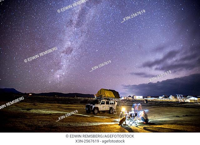 Land Rover with camp set up beneath the Milky Way in Sani Pass, Lesotho, Africa
