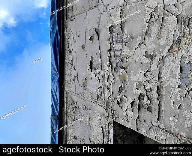 Close-up of the damaged wall of a building