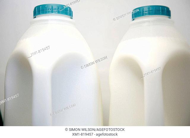 Two plastic bottles of milk