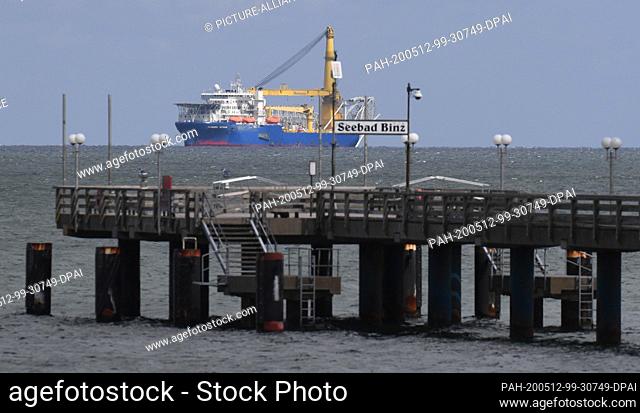 12 May 2020, Mecklenburg-Western Pomerania, Sassnitz: The Russian laying ship ""Akademik Tscherski"" lies in front of the pier of the Baltic resort Binz