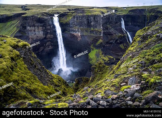 dramatic landscape of epic haifoss waterfall in landmannalaugar canyon, iceland