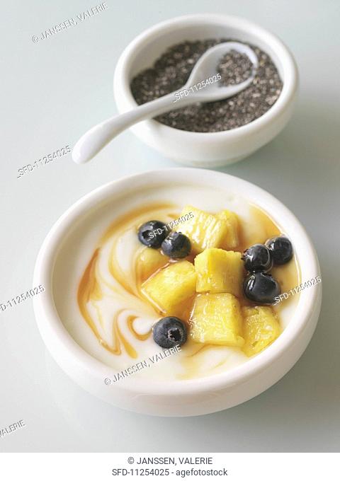 Yogurt with fresh fruit and a bowl of chia seeds