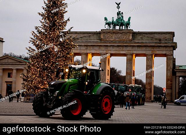 18 December 2023, Berlin: Farmers with tractors take part in a demonstration organized by the German Farmers' Association under the slogan ""Too much is too...