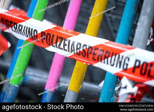 19 April 2021, Baden-Wuerttemberg, Stuttgart: A flutter tape with the inscription ""police cordon"" hangs on barrier fences. Photo: Marijan Murat/dpa