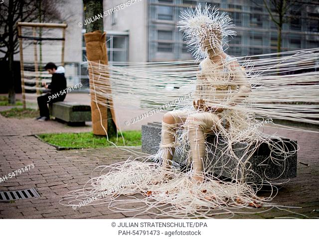 A window mannequin wrapped into clothesline and spined with cable ties stands on the Theodor-Lessing-Place in Hanover, Germany, 5 January 2015
