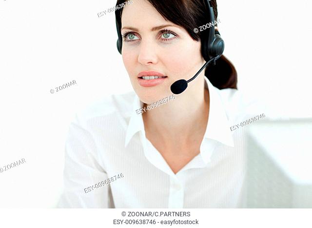 Serious businesswoman with headset on