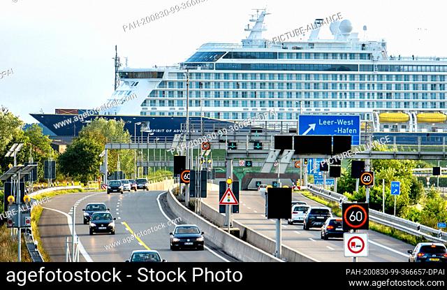 30 August 2020, Lower Saxony, Leer: Cars are on the A31 motorway, while the new cruise ship ""Spirit of Adventure"" is passing through the Ems Tunnel