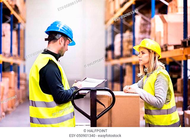 Young workers working together in a warehouse