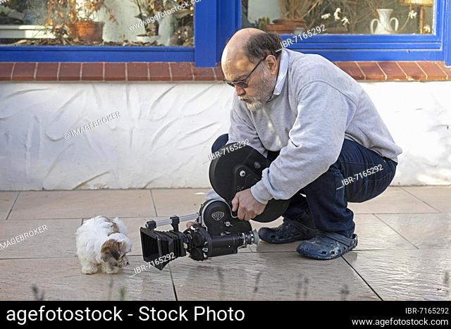 Animal photographer films Bolonka Zwetna puppy with 16mm camera, Germany, Europe