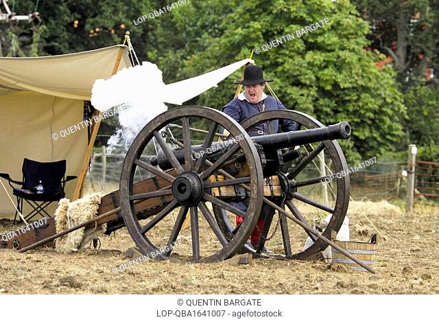 England, Essex, Saffron Walden. Gun being fired in an English civil war re-enactment near Saffron Walden in Essex