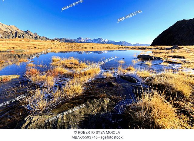 Rocky peaks of Bernina Group are reflected in the alpine lake Val Torreggio Malenco Valley Valtellina Lombardy Italy Europe