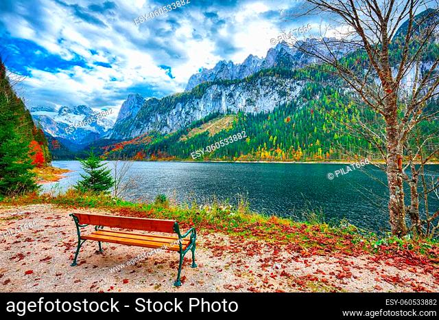 Beautiful view of idyllic colorful autumn scenery with Dachstein mountain summit by Gosausee mountain lake in fall Salzkammergut region Upper Austria Austria
