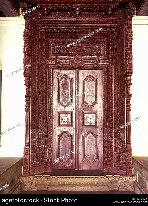 The Portal of a Nagarathar house, exquisitely carved teak wood in a hall mark of Chettinad house, Tamil Nadu, India, Asia