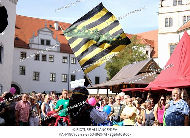 08 September 2018, Germany, Torgau: Flag-wringers perform at an event in Schloss Hartenfels on the 27th day of the Saxony