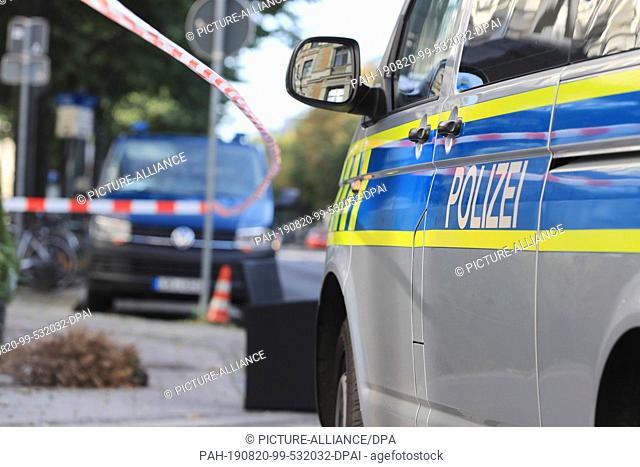 20 August 2019, Saxony-Anhalt, Magdeburg: A police car stands in front of a restaurant in the state capital. At least two people were injured during the night...