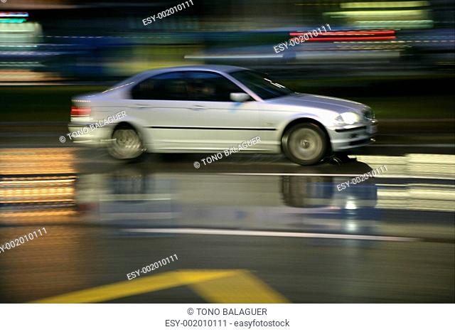 Car moving in rainy night motion blur