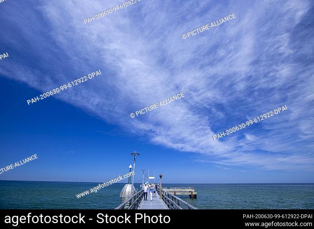 24 June 2020, Mecklenburg-Western Pomerania, Zingst: With the diving gondola at the Zingst pier, holidaymakers can observe the underwater world in the Baltic...