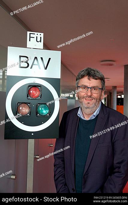 PRODUCTION - 06 December 2023, Switzerland, Bern: Peter Füglistaler, Director of the Swiss Federal Office of Transport, stands next to a railroad signal that...