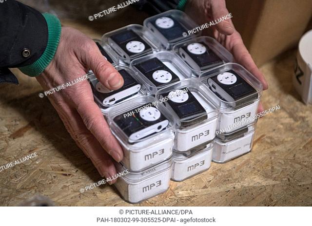 28 February 2018, Germany, Frankfurt: German customs seized fake MP3 players at a secret shipping's storage at an industrial estate