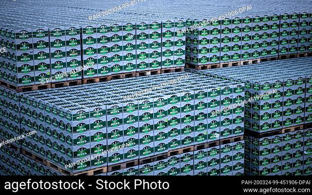17 March 2020, Bremen: Crates of Beck's beer are parked in front of the brewery Beck & Co. Photo: Sina Schuldt/dpa. - Bremen/Bremen/Germany