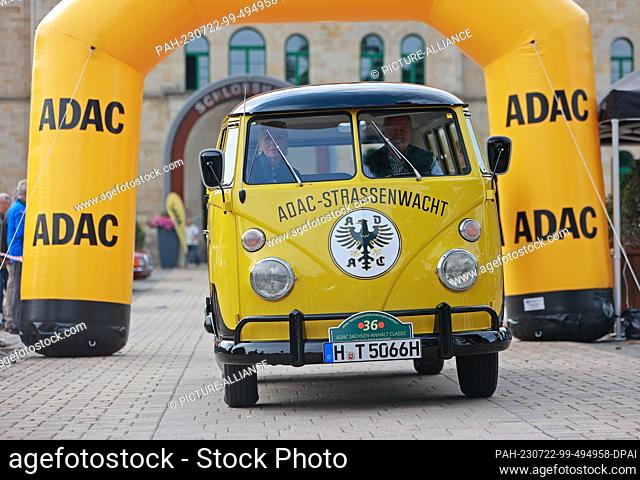 22 July 2023, Saxony-Anhalt, Blankenburg: View of a VW T1 bus from 1966. Participants stand at the start of the traditional classic car excursion ""ADAC...