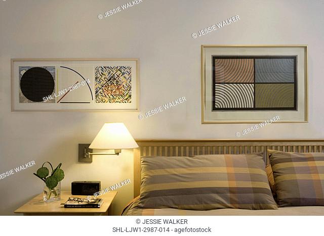 BEDROOM: CLOSE UP detail of 20thc art print making , Sol LeWitt, Jennifer Bartlett, birch colored mission style headboard, neutral pattern bedding
