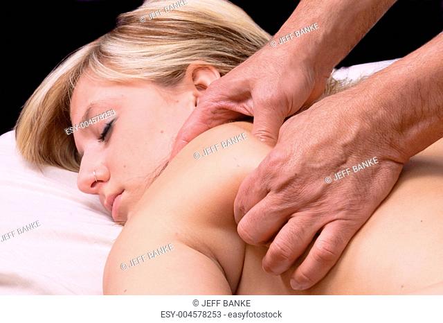 young woman getting Massage Therepy from a massuer