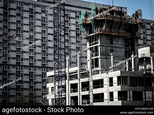 Construction site with block of flats in background. Warsaw, Poland