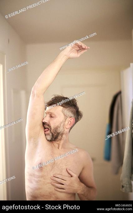 Man licking his armpit