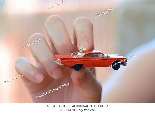 1959 Buick Electra model by Husky held by a woman's hand