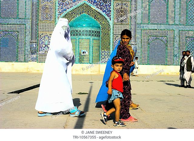 Mazar-I-Sharif Afghanistan Women wearing Burkas with their Children at the Shrine of Hazrat Ali  who was assassinated in 661  Shrine was built here in 1136 on...
