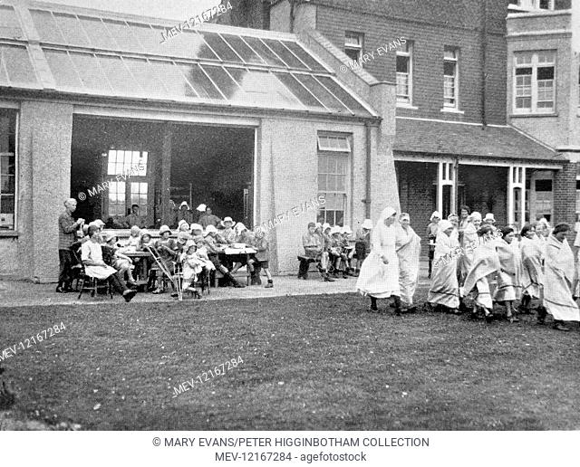 A group off to sea-bathe at the Millfield Seaside Home at Rustington, Littlehampton, Sussex. It was opened by the Metropolitan Asylums Board in 1904 as a...