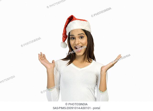 Woman wearing a Santa hat and smiling