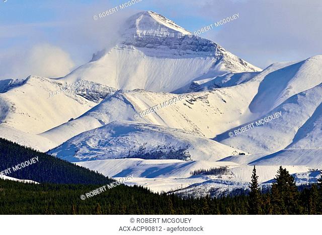 Luscar mountain near Cadomine Alberta with a blanket of fresh snow covering its tall peak