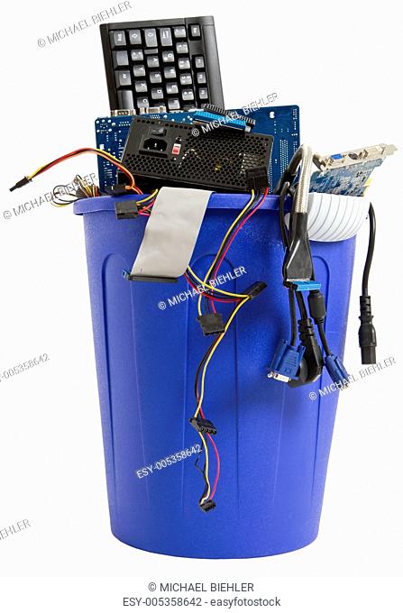 electronic scrap in blue trash can