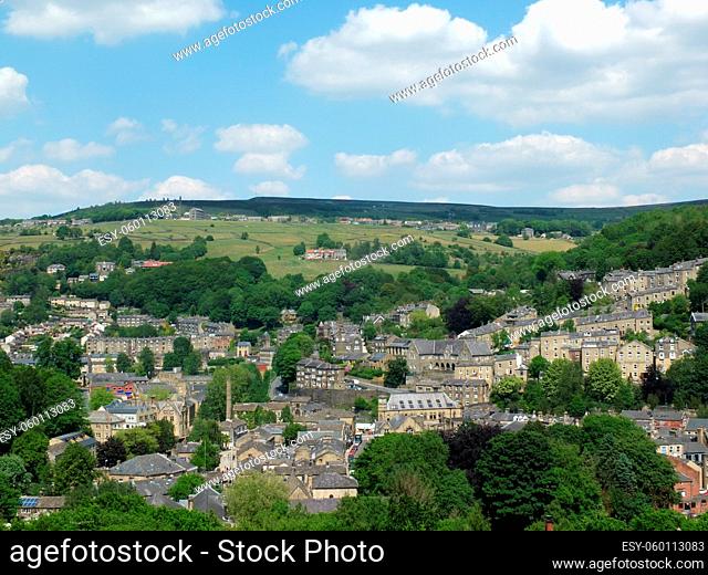 panoramic view of the streets and houses in hebden bridge in west yorkshire in summer surrounded by trees and hills