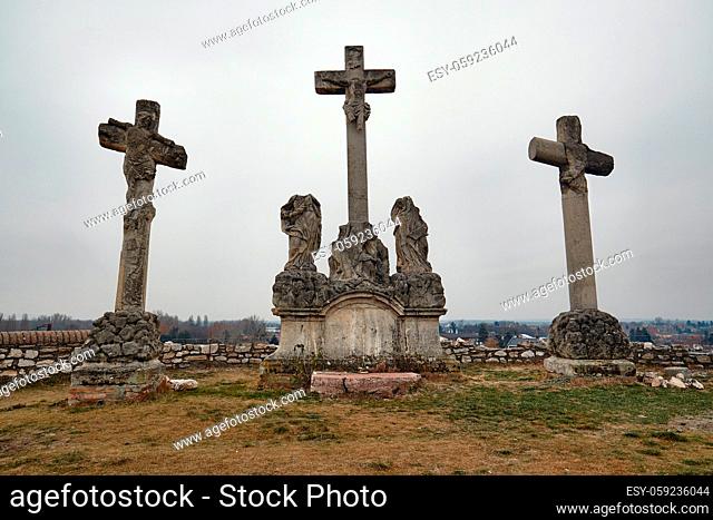 Crosses on the hill, weathered old sculptures damaged over the years