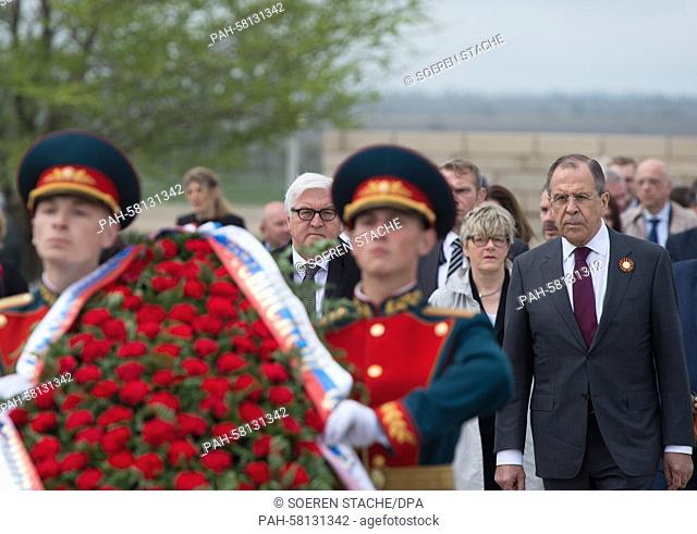 German Foreign Minster Frank-Walter Steinmeier, along with his Russian counterpart Sergey Lavrov (R), lays down a wreath at the German and Russian War Cemetery...