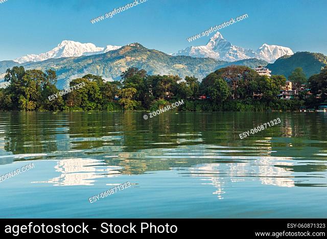 The Machapuchare and Annapurna range seen from Phewa Lake in Pokhara, Nepal