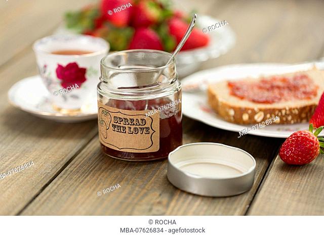 Strawberry jam, bread, preserving jar