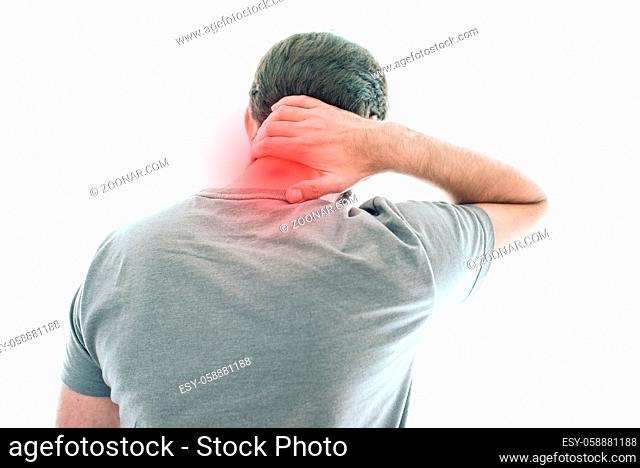 rear view of man suffering from neck pain