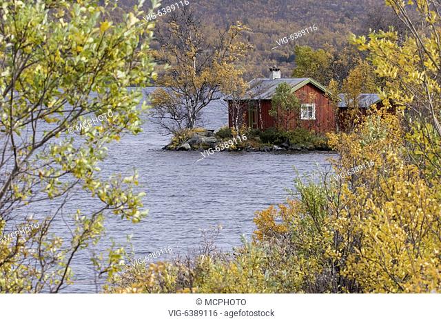 NOR, DOVREFJELL, 23.09.2018, cabin at lake in autumn - Dovrefjell, Oppland, Norway, 23/09/2018