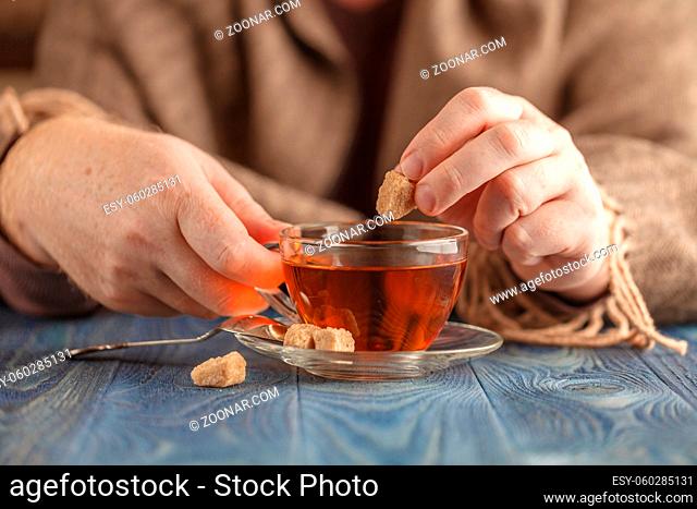 Dunking sugar in hot tea